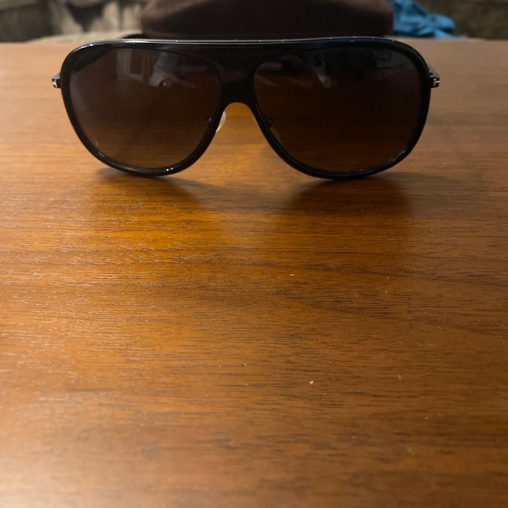 I’m selling black oversized aviators by Tom ford